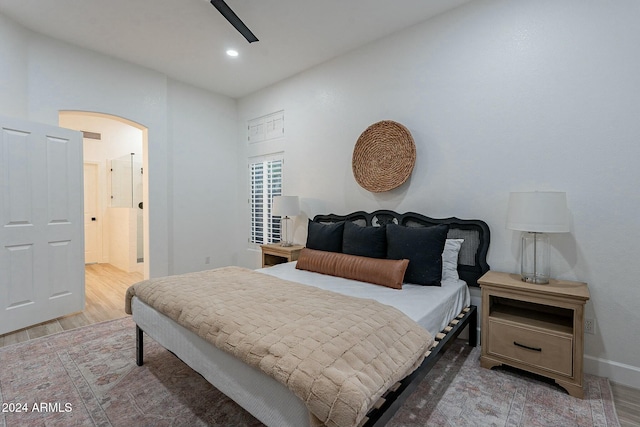 bedroom featuring hardwood / wood-style flooring and ceiling fan