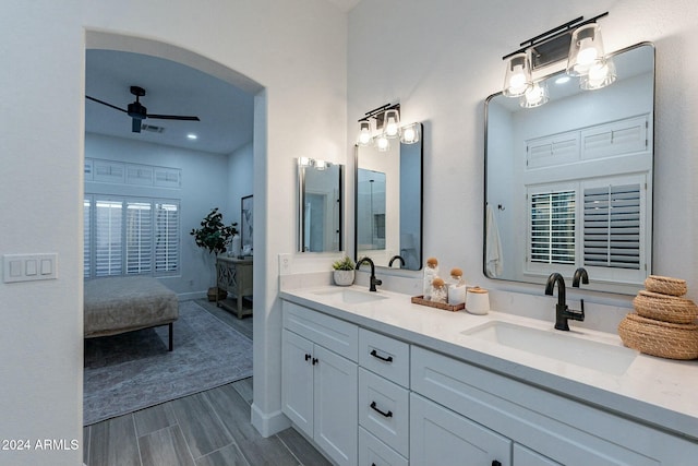 bathroom featuring hardwood / wood-style floors, vanity, and ceiling fan