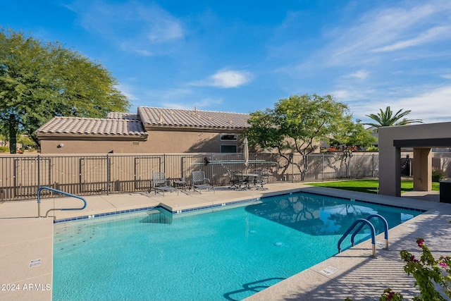 view of pool featuring a patio