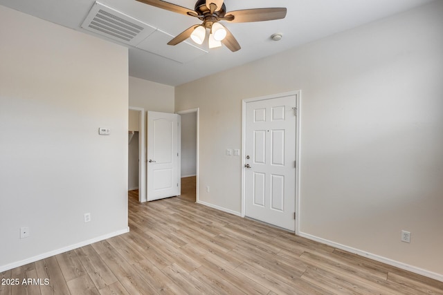 9165 W Mine Trl, Peoria, AZ 85383 - spare room featuring light wood-type flooring, baseboards, a ceiling fan, and a smoke detector