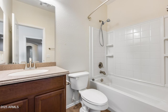 9165 W Mine Trl, Peoria, AZ 85383 - bathroom featuring washtub / shower combination, toilet, vanity, and baseboards