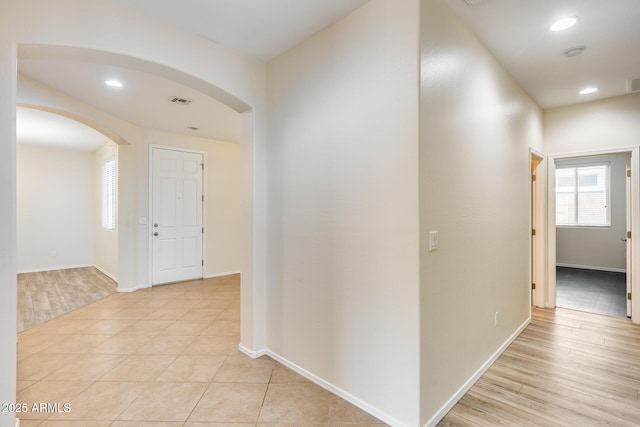 9165 W Mine Trl, Peoria, AZ 85383 - hall featuring arched walkways, light wood-style floors, baseboards, and recessed lighting