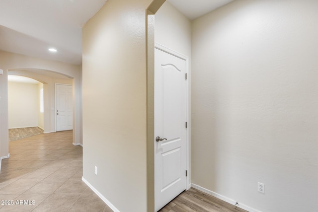 9165 W Mine Trl, Peoria, AZ 85383 - hall with arched walkways, baseboards, recessed lighting, and light tile patterned floors