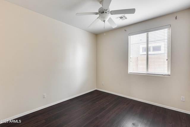 9165 W Mine Trl, Peoria, AZ 85383 - spare room featuring baseboards, dark wood-style flooring, and ceiling fan