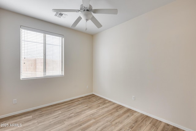 9165 W Mine Trl, Peoria, AZ 85383 - empty room featuring light wood-style flooring, a ceiling fan, and baseboards
