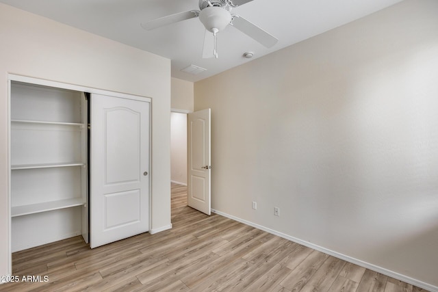 9165 W Mine Trl, Peoria, AZ 85383 - unfurnished bedroom with light wood-style flooring, a closet, baseboards, and ceiling fan