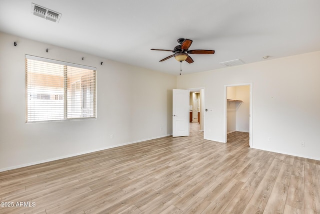 9165 W Mine Trl, Peoria, AZ 85383 - spare room featuring light wood-style flooring, ceiling fan, and baseboards