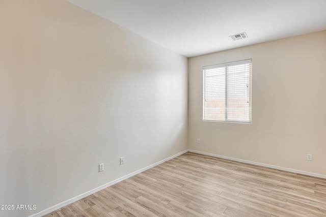 9165 W Mine Trl, Peoria, AZ 85383 - unfurnished room featuring light wood-style floors and baseboards