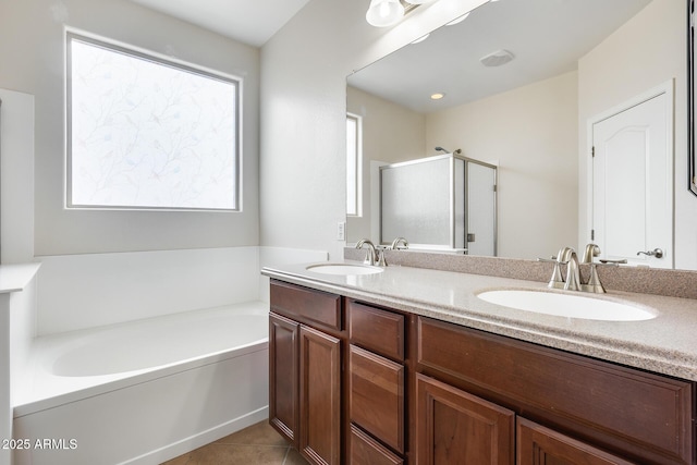 9165 W Mine Trl, Peoria, AZ 85383 - bathroom featuring a shower stall, a bath, double vanity, and tile patterned flooring