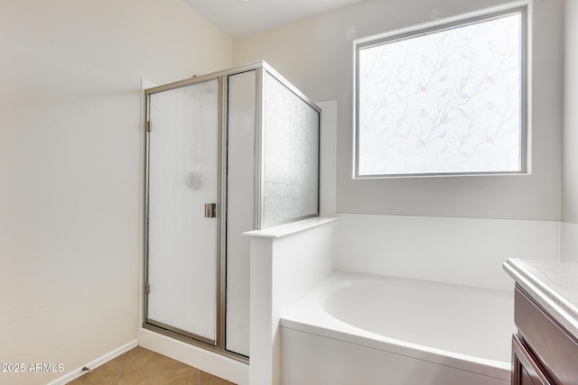 9165 W Mine Trl, Peoria, AZ 85383 - bathroom with a stall shower, a garden tub, vanity, and tile patterned flooring