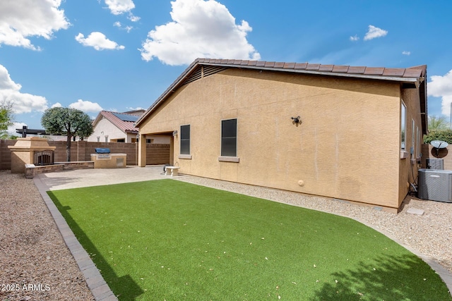 9165 W Mine Trl, Peoria, AZ 85383 - back of property with stucco siding, central air condition unit, and a patio area