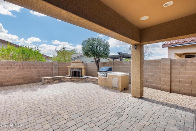9165 W Mine Trl, Peoria, AZ 85383 - fenced backyard with a patio area and exterior fireplace
