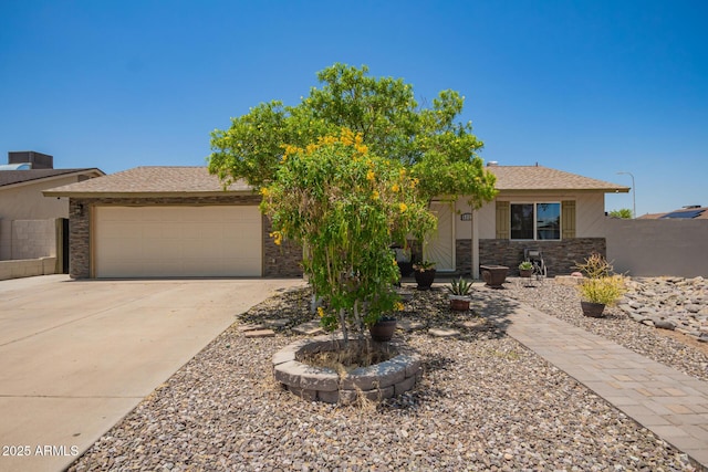 6802 S 47th St, Phoenix, AZ 85042 - view of front of property with an attached garage, driveway, and stone siding