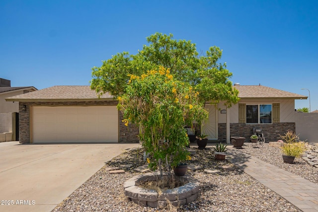 6802 S 47th St, Phoenix, AZ 85042 - view of front of property with driveway, a garage, stone siding, and a shingled roof