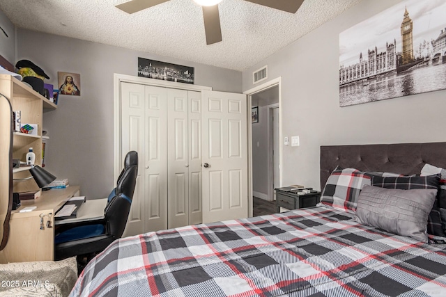 6802 S 47th St, Phoenix, AZ 85042 - bedroom featuring a closet, a textured ceiling, and ceiling fan