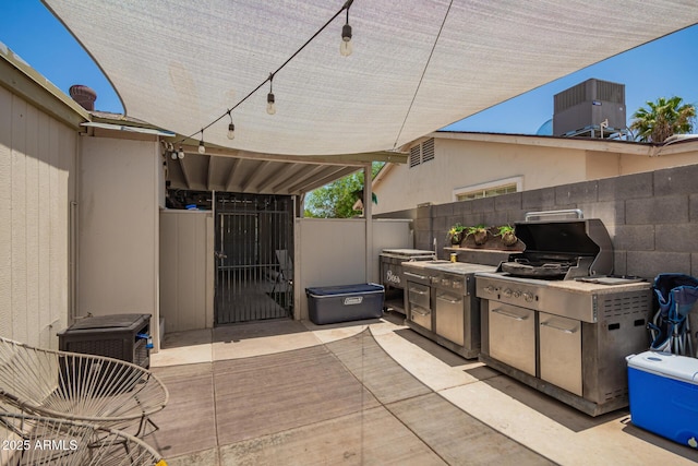 6802 S 47th St, Phoenix, AZ 85042 - view of patio / terrace featuring a gate