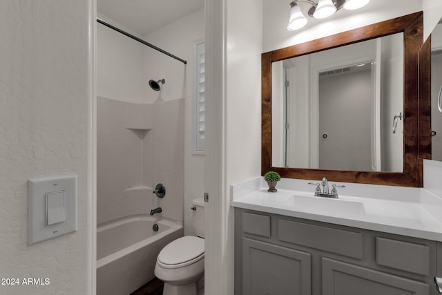 full bathroom featuring toilet, vanity, and shower / washtub combination