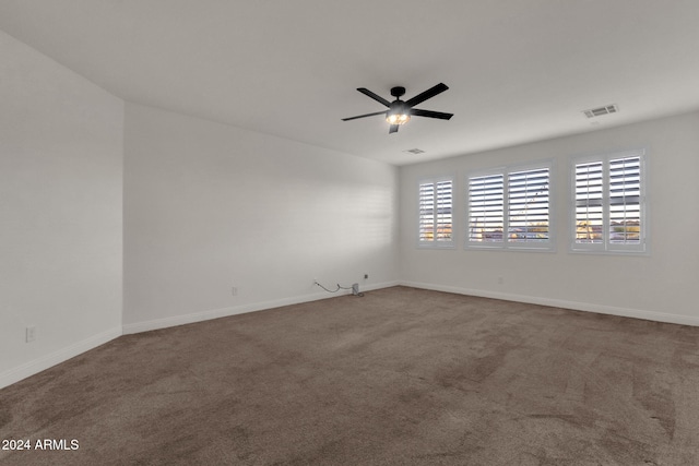 unfurnished room featuring carpet floors and ceiling fan