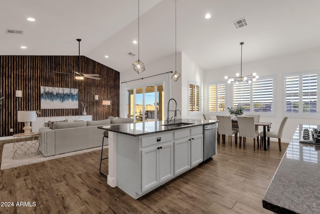 kitchen featuring hardwood / wood-style floors, sink, an island with sink, white cabinets, and stainless steel dishwasher