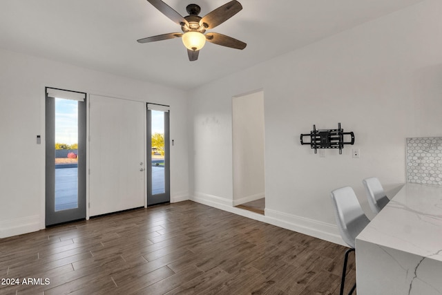 entryway with ceiling fan and dark hardwood / wood-style flooring