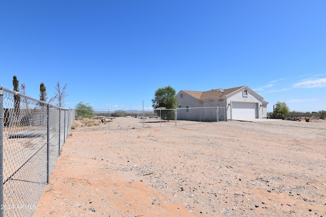 view of yard with a garage