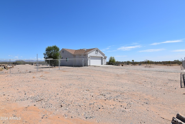 view of yard featuring a garage