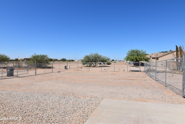 view of yard with a rural view