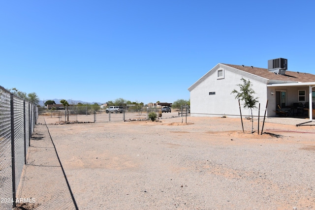 view of yard featuring central AC