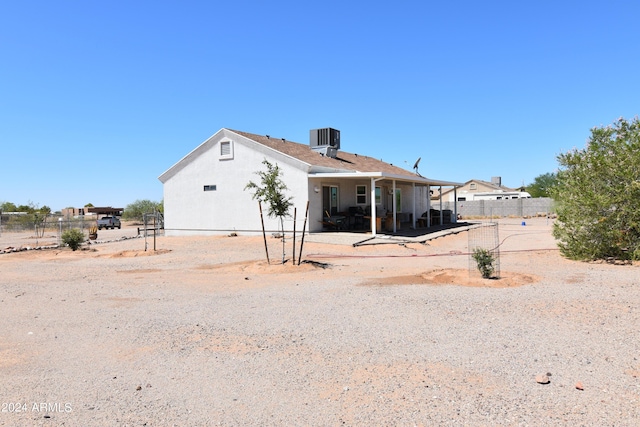 back of house featuring cooling unit and a patio area