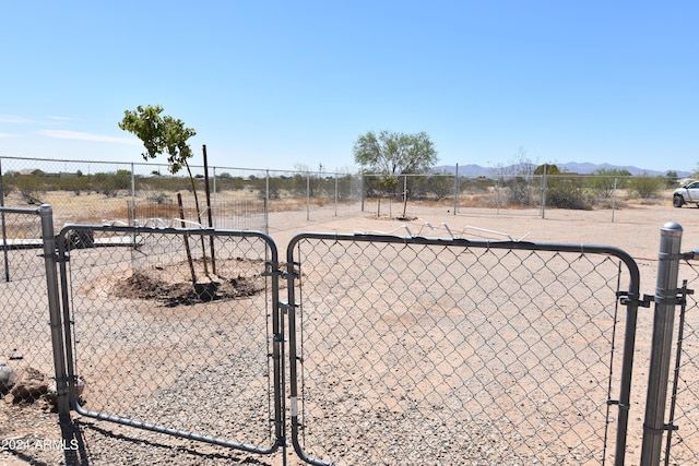 view of gate with a mountain view