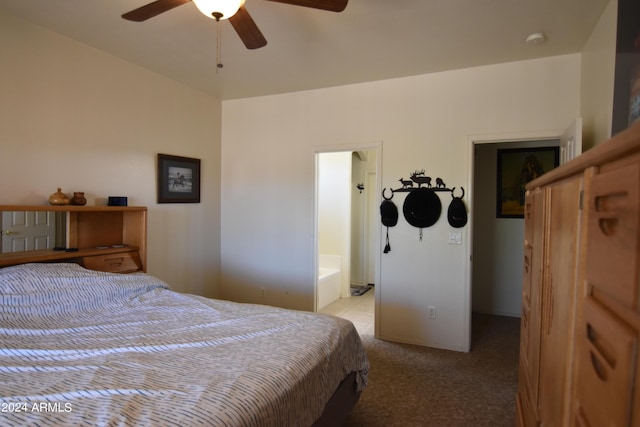 carpeted bedroom featuring connected bathroom and ceiling fan