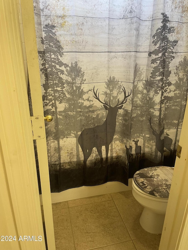 bathroom featuring tile patterned floors and toilet