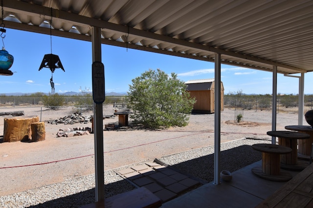 view of patio with a storage unit