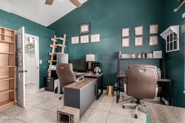 office space featuring tile patterned floors, ceiling fan, and lofted ceiling