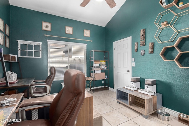 office area with light tile patterned floors and ceiling fan