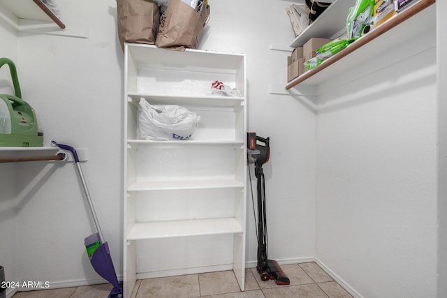 walk in closet featuring light tile patterned floors