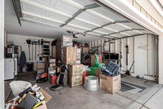 garage with water heater and a garage door opener