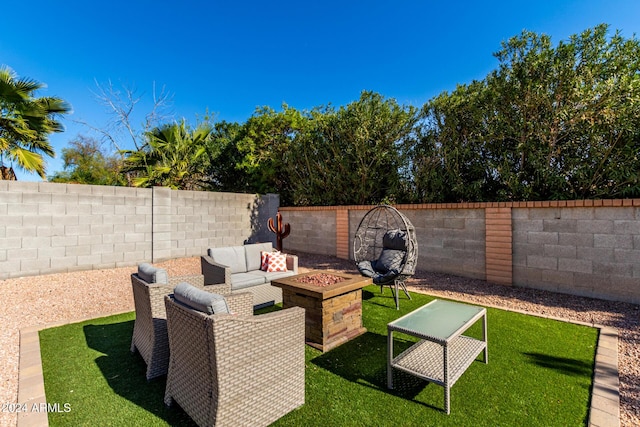 view of patio / terrace with an outdoor living space with a fire pit