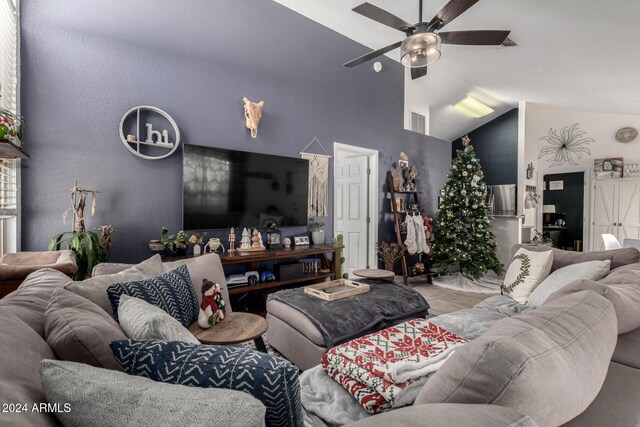 living room with vaulted ceiling and ceiling fan