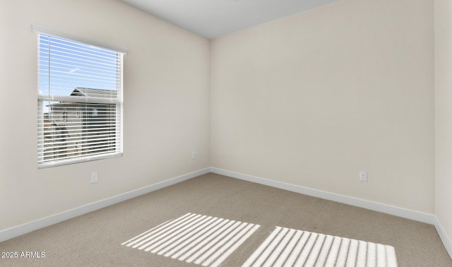 empty room with light colored carpet