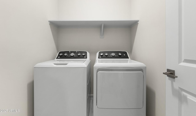 washroom featuring washer and dryer