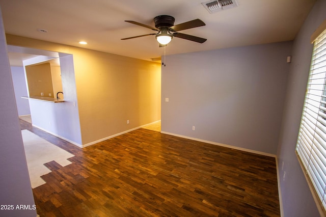 44944 W Miramar Rd, Maricopa, AZ 85139 - spare room with a ceiling fan, wood finished floors, baseboards, and recessed lighting