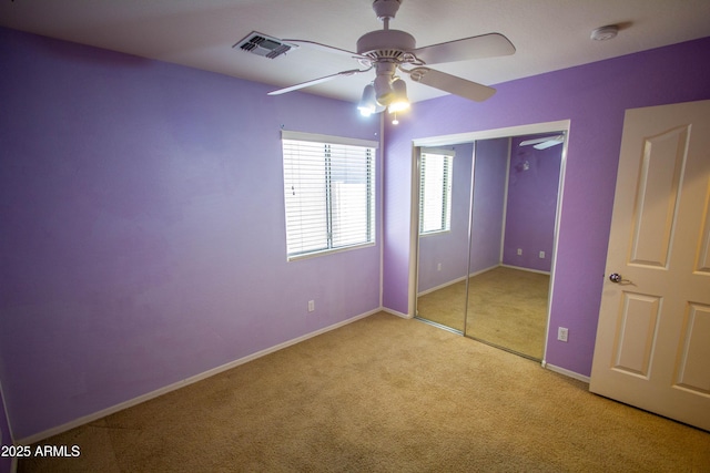 44944 W Miramar Rd, Maricopa, AZ 85139 - unfurnished bedroom featuring carpet, baseboards, a ceiling fan, and a closet