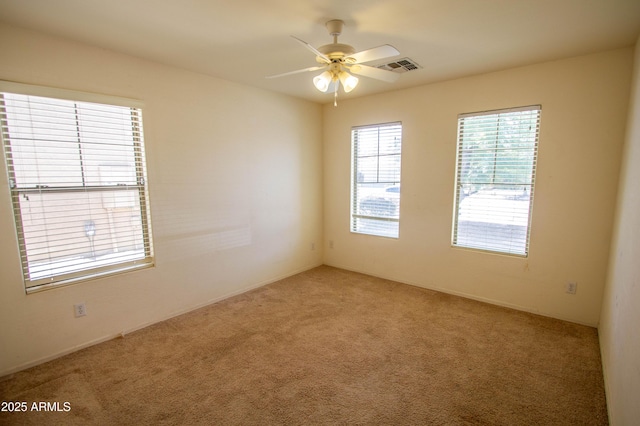 44944 W Miramar Rd, Maricopa, AZ 85139 - spare room featuring light colored carpet and a ceiling fan