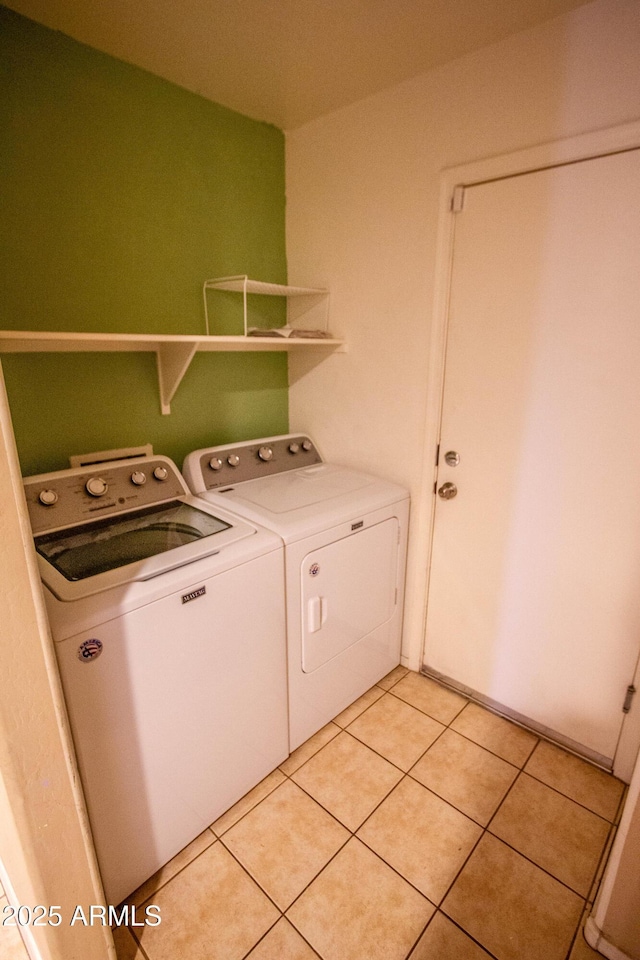 44944 W Miramar Rd, Maricopa, AZ 85139 - washroom featuring separate washer and dryer and light tile patterned floors