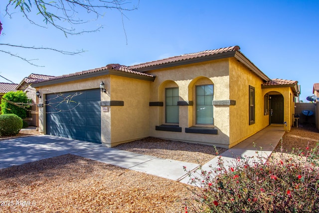 44944 W Miramar Rd, Maricopa, AZ 85139 - mediterranean / spanish home with a garage, stucco siding, concrete driveway, and a tiled roof