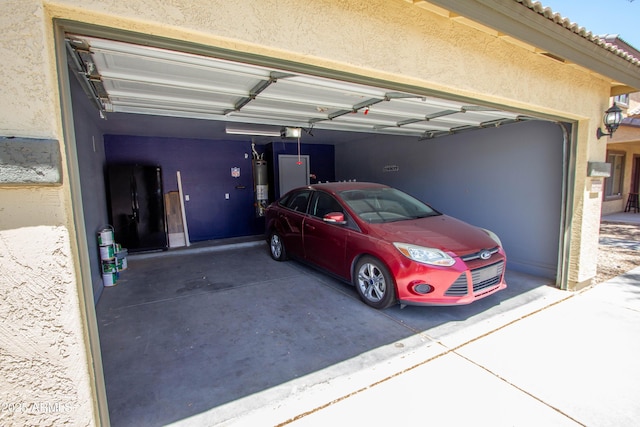 44944 W Miramar Rd, Maricopa, AZ 85139 - garage with gas water heater and a garage door opener