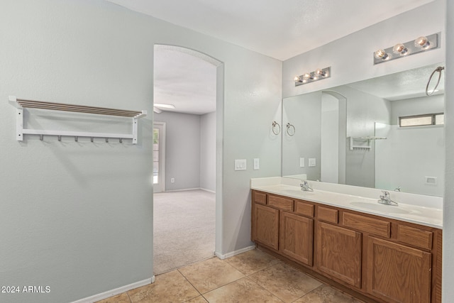 bathroom featuring tile patterned flooring and vanity