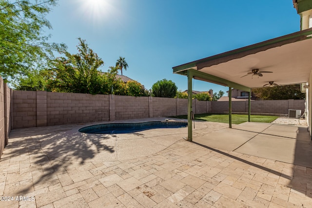 view of pool with central AC unit, ceiling fan, and a patio area