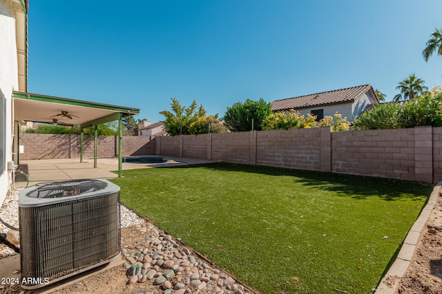 view of yard featuring central air condition unit, a patio area, and ceiling fan